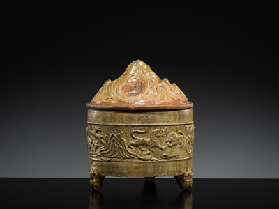 Lot 219 - A GREEN-GLAZED POTTERY ‘HILL’ TRIPOD JAR AND COVER, LIAN, HAN DYNASTY