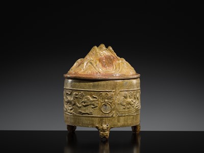 Lot 219 - A GREEN-GLAZED POTTERY ‘HILL’ TRIPOD JAR AND COVER, LIAN, HAN DYNASTY
