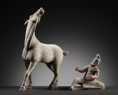 Lot 131 - A HIGHLY DETAILED POTTERY GROUP OF A HORSE WITH ITS GROOM, TANG DYNASTY