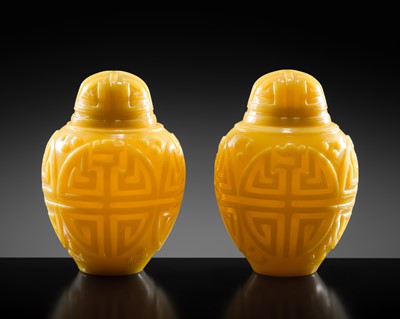 Lot 97 - A RARE PAIR OF CARVED YELLOW GLASS JARS AND COVERS, 19TH CENTURY