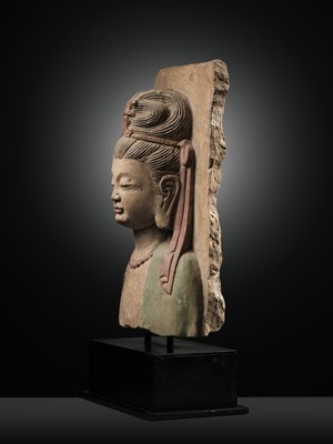 Lot 332 - A RARE PAINTED LIMESTONE RELIEF OF GUANYIN, NORTHERN WEI TO SUI DYNASTY