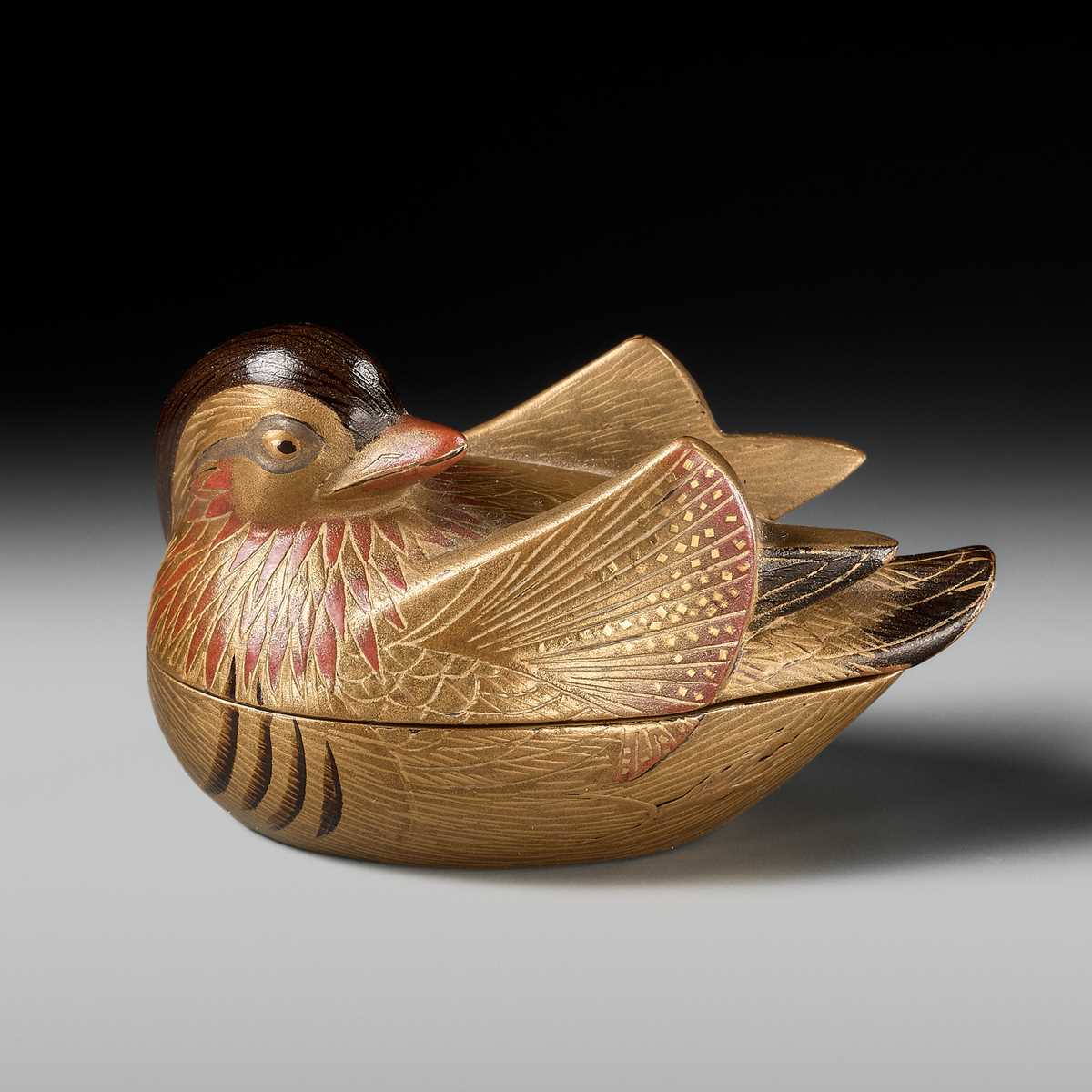 Lot 490 - SHUNSHO: A FINE AND LARGE LACQUER HAKO NETSUKE OF AN OSHIDORI (MANDARIN DUCK)
