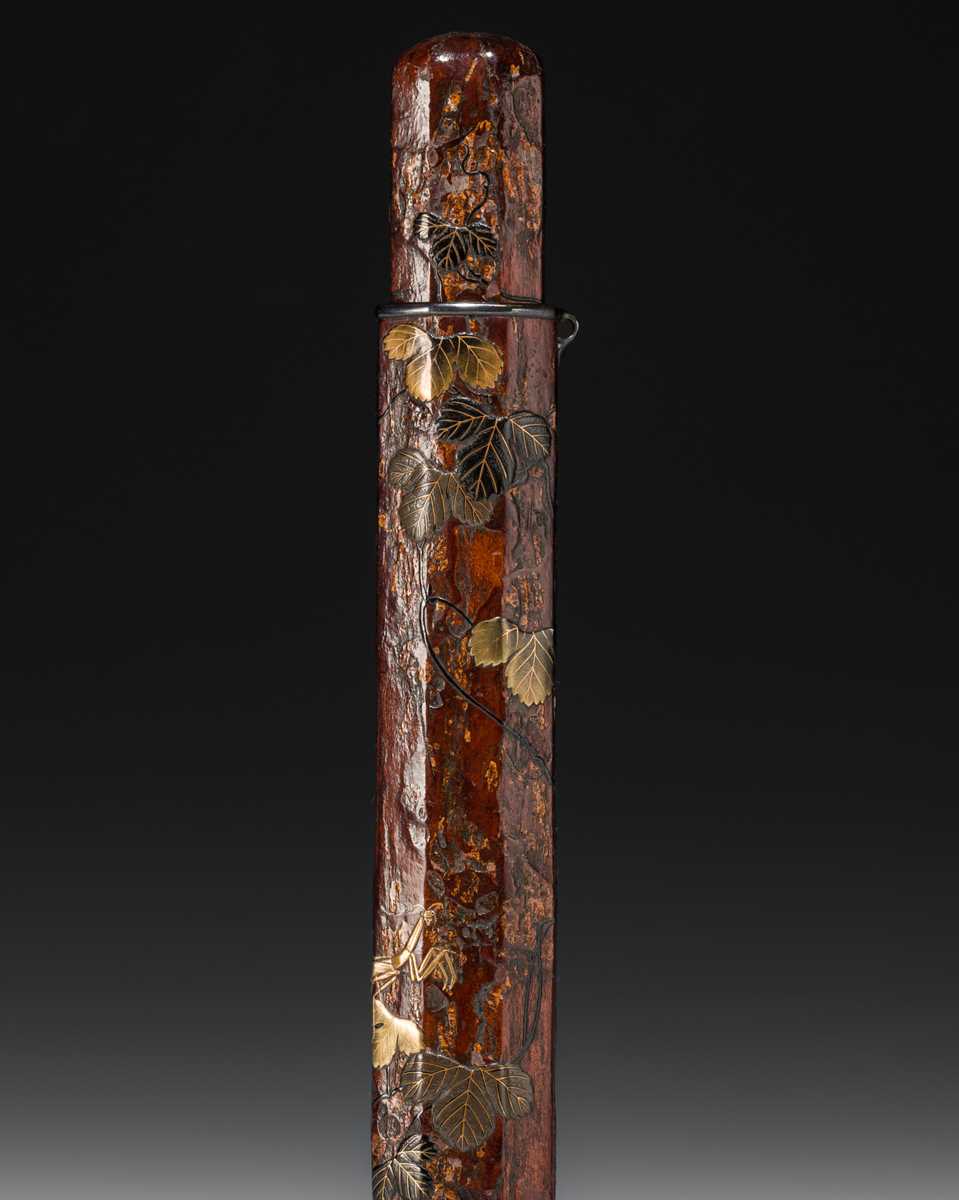 Lot 65 - BUNSAI: A LACQUERED WOOD KISERUZUTSU (PIPE CASE) WITH LEAFY VINES AND A MANTIS