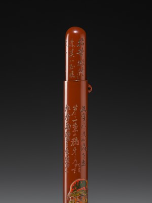 A FINE GURI LACQUER WOOD KISERUZUTSU (PIPE CASE) OF DARUMA, DATED 1922