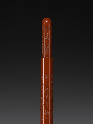 A FINE GURI LACQUER WOOD KISERUZUTSU (PIPE CASE) OF DARUMA, DATED 1922