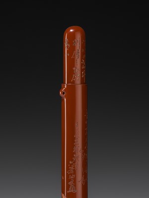 A FINE GURI LACQUER WOOD KISERUZUTSU (PIPE CASE) OF DARUMA, DATED 1922