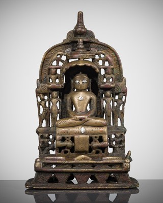 Lot 336 - A JAIN COPPER AND SILVER-INLAID BRASS SHRINE OF PARSHVANATHA, DATED 1398