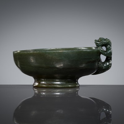 Lot 450 - A DARK-GREEN JADE ‘CHILONG’ LIBATION CUP, EARLY QING DYNASTY