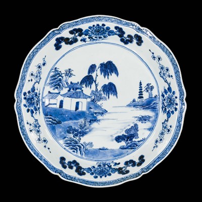 Lot 283 - A BARBED BLUE AND WHITE ‘LANDSCAPE’ CHARGER, QIANLONG PERIOD