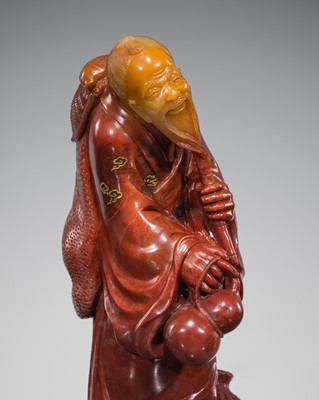 Lot 112 - AN UNUSUAL SOAPSTONE FIGURE OF LI TIEGUAI, QING DYNASTY