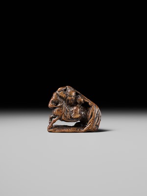 Lot 210 - SHOUNSAI JORYU: A WOOD NETSUKE OF KWANYU ON HORSEBACK