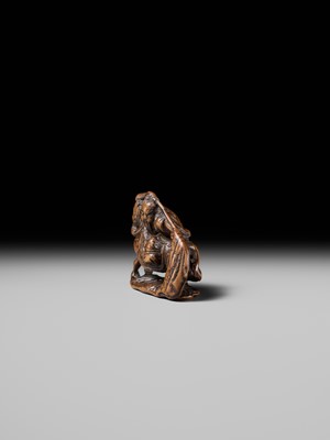 Lot 210 - SHOUNSAI JORYU: A WOOD NETSUKE OF KWANYU ON HORSEBACK