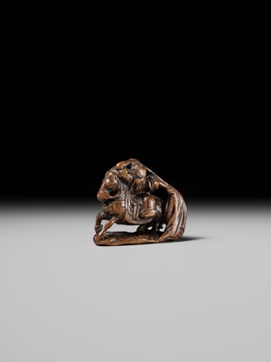 Lot 210 - SHOUNSAI JORYU: A WOOD NETSUKE OF KWANYU ON HORSEBACK