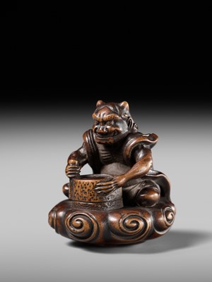 Lot 227 - HOSHUNSAI MASAYUKI: A FINE WOOD NETSUKE OF A RAIJIN ON A CLOUD