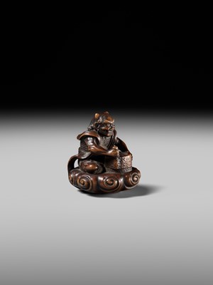 Lot 227 - HOSHUNSAI MASAYUKI: A FINE WOOD NETSUKE OF A RAIJIN ON A CLOUD