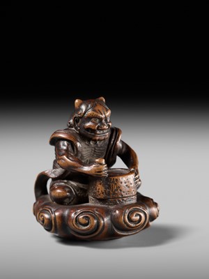 Lot 227 - HOSHUNSAI MASAYUKI: A FINE WOOD NETSUKE OF A RAIJIN ON A CLOUD