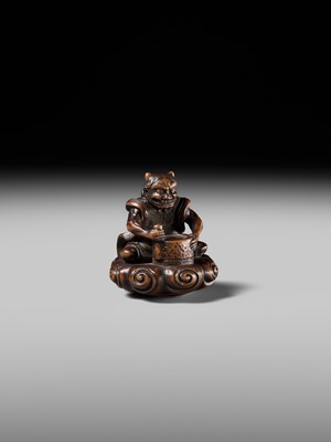 Lot 227 - HOSHUNSAI MASAYUKI: A FINE WOOD NETSUKE OF A RAIJIN ON A CLOUD