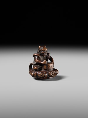 Lot 227 - HOSHUNSAI MASAYUKI: A FINE WOOD NETSUKE OF A RAIJIN ON A CLOUD