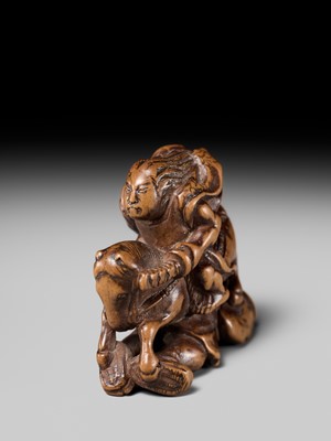 Lot 208 - SHOZAN: AN EARLY EDO SCHOOL WOOD NETSUKE OF A WARRIOR ON HORSEBACK