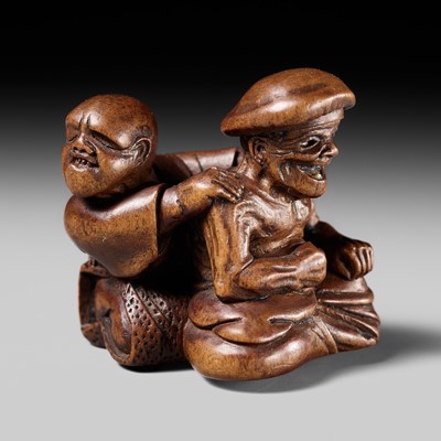 Lot 486 - MIWA: A FINE WOOD NETSUKE OF A BLIND MASSEUR AND CLIENT