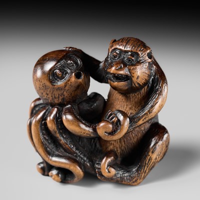 Lot 241 - TOMOYUKI: A WOOD NETSUKE OF A MONKEY AND OCTOPUS WRESTLING