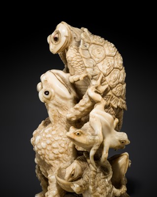 Lot 374 - AN AMUSING HIPPOPOTAMUS TOOTH OKIMONO OF WRESTLING FROGS AND TURTLES