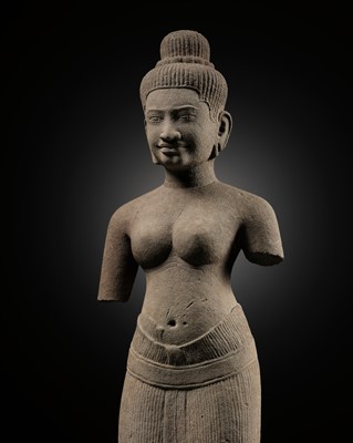 Lot 256 - A SANDSTONE FIGURE OF UMA, BAPHUON STYLE, ANGKOR PERIOD