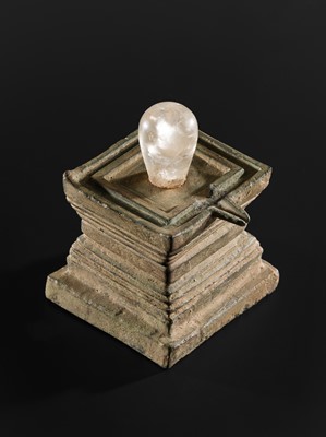 Lot 682 - A ROCK CRYSTAL LINGA AND BRONZE YONI, ANGKOR PERIOD