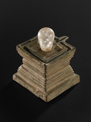 Lot 682 - A ROCK CRYSTAL LINGA AND BRONZE YONI, ANGKOR PERIOD