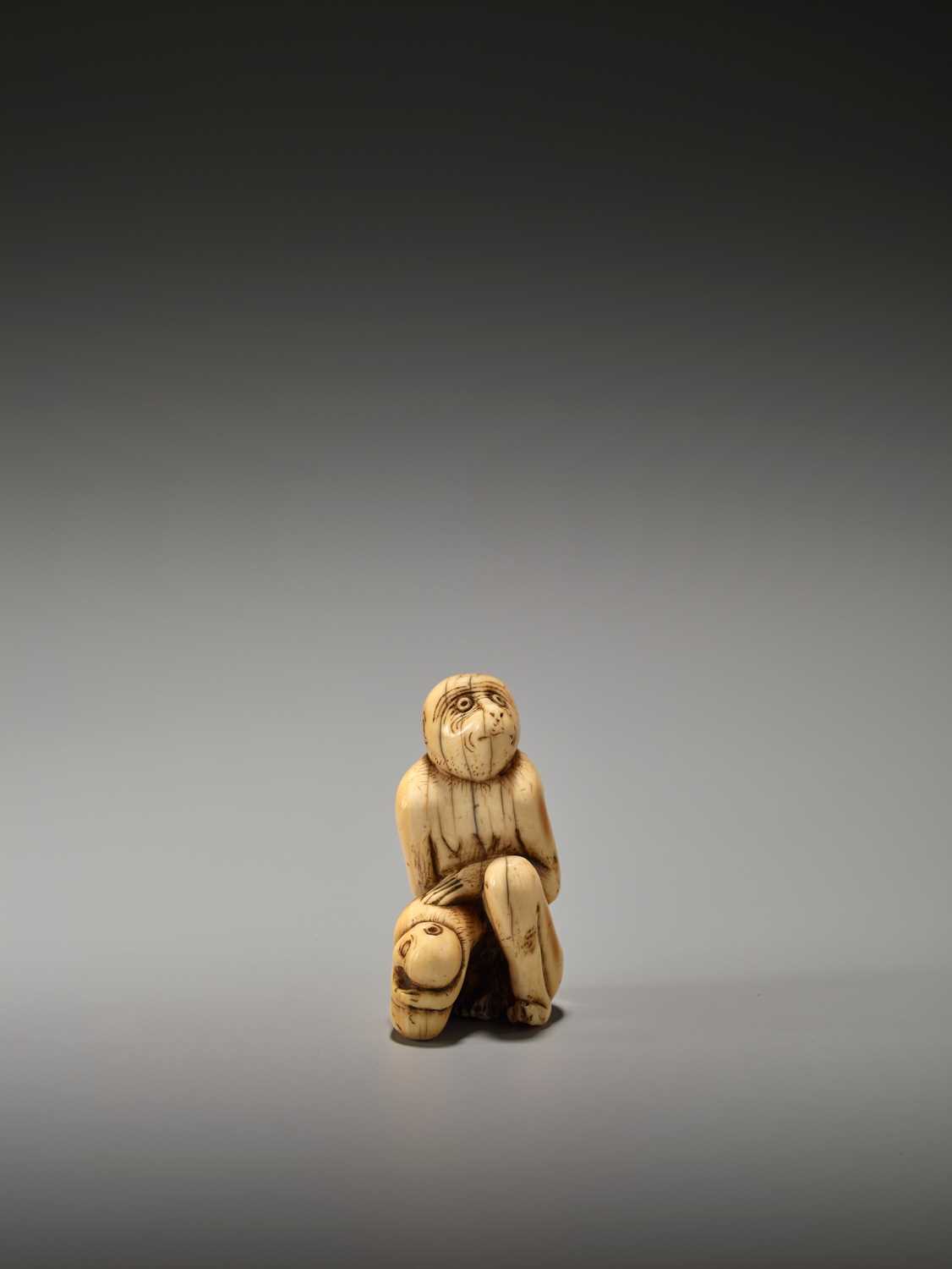 Lot 18 - A RARE AND EARLY IVORY NETSUKE OF A MONKEY WITH YOUNG