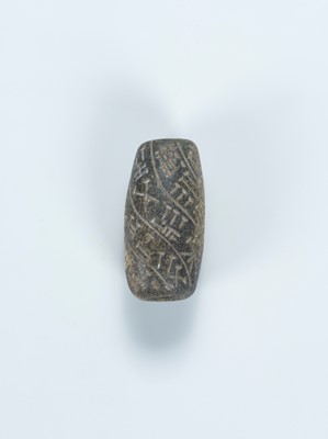 Lot 2070 - A CUNEIFORM INSCRIBED STONE BEAD