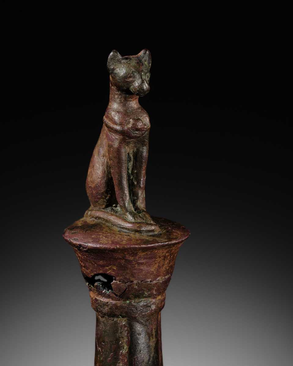 Lot 35 - A FINE BRONZE FIGURE OF A CAT ON A COLUMN, BASTET, LATE PERIOD