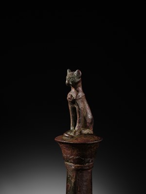 Lot 35 - A FINE BRONZE FIGURE OF A CAT ON A COLUMN, BASTET, LATE PERIOD