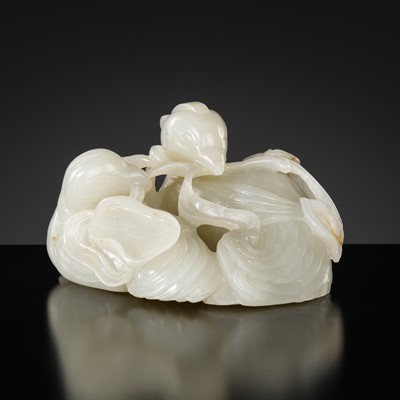 Lot 460 - A WHITE AND RUSSET JADE ‘PHOENIXES AND LOTUS’ GROUP, 18TH CENTURY