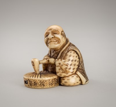 Lot 1235 - GESSHO: A WALRUS TUSK NETSUKE OF A CRAFTSMAN