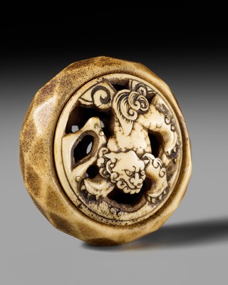 Lot 321 - AN ANTLER RYUSA MANJU NETSUKE OF A SHISHI