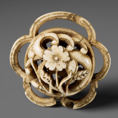 Lot 318 - AN ANTLER RYUSA NETSUKE DEPICTING PLUM BLOSSOMS