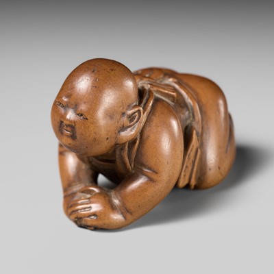 Lot 505 - MASAKATSU: A WOOD NETSUKE OF A BABY BOY