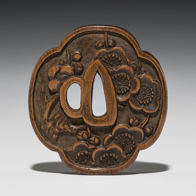 Lot 1236 - ISSHO: A WOOD NETSUKE OF A TSUBA