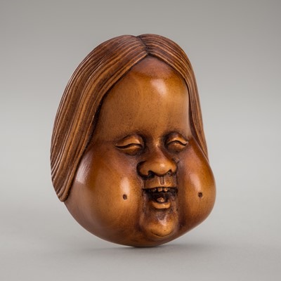 Lot 1446 - A PALE BOXWOOD MASK NETSUKE OF OKAME