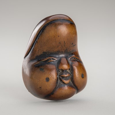 Lot 1448 - HIDEKAZU: A WOOD MASK NETSUKE OF OKAME