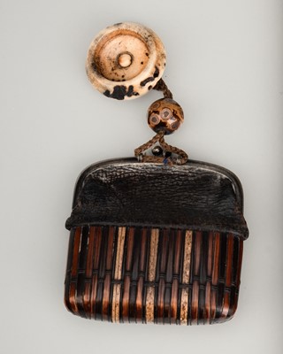 Lot 1287 - A RARE LEATHER AND RATTAN KINCHAKU (POUCH) WITH OJIME AND NETSUKE