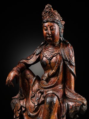 Lot 49 - A FINE GILT LACQUER WOOD FIGURE OF SEATED GUANYIN, LATE MING DYNASTY