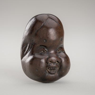 Lot 1444 - A WOOD MASK NETSUKE OF OKAME