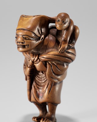 Lot 442 - A FINE WOOD NETSUKE OF A SARUMAWASHI