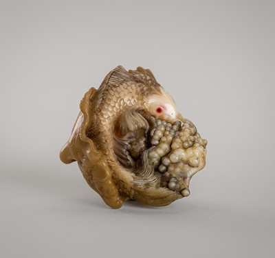 Lot 1427 - VASILY PATOKIN: A MARINE TUSK NETSUKE OF A FISH WITH ROE