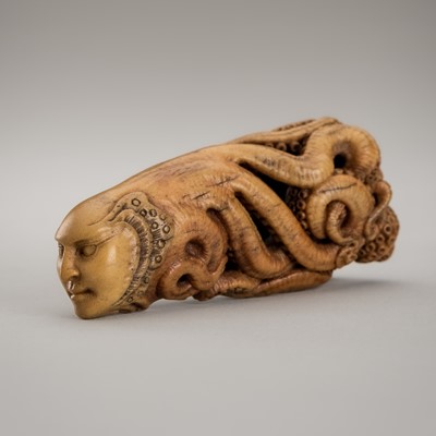 Lot 1426 - VASILY PATOKIN: A MAMMOTH IVORY NETSUKE OF A HUMANOID OCTOPUS