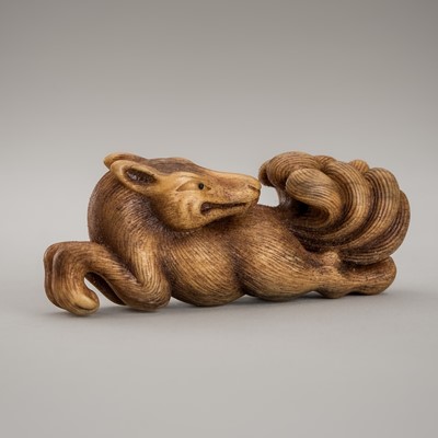 Lot 1425 - VASILY PATOKIN: A MAMMOTH IVORY NETSUKE OF A FOX