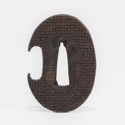 Lot 1515 - AN IRON HAMIDASHI TSUBA WITH BROCADE DIAPERED GROUND