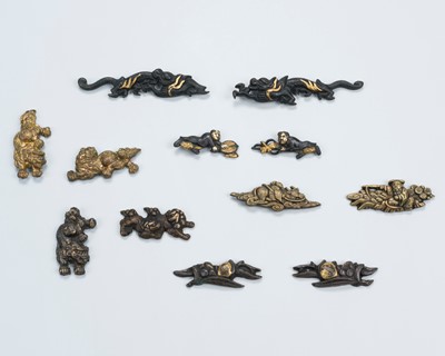 Lot 1674 - A GROUP OF TWELVE MENUKI, FOUR PAIRS, AND FOUR SINGLE PIECES